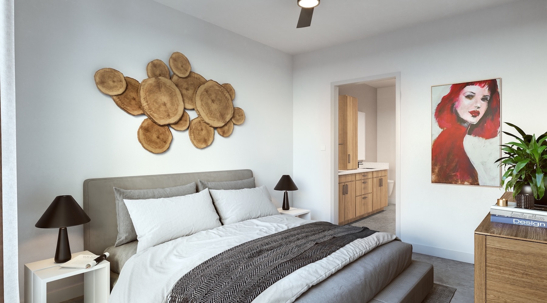 bedroom with bed dresser plant and art on the wall